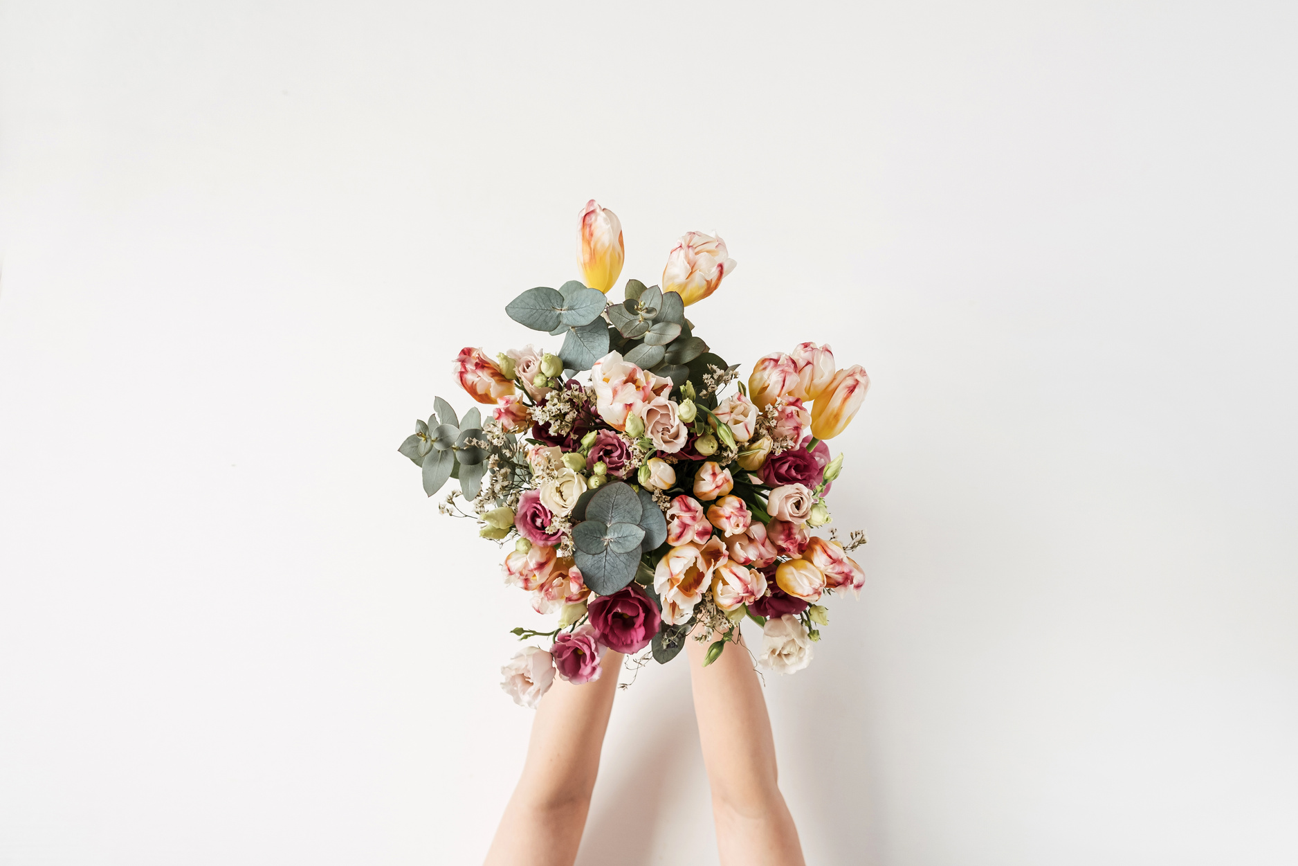 Hands Holding Bouquet of Flowers